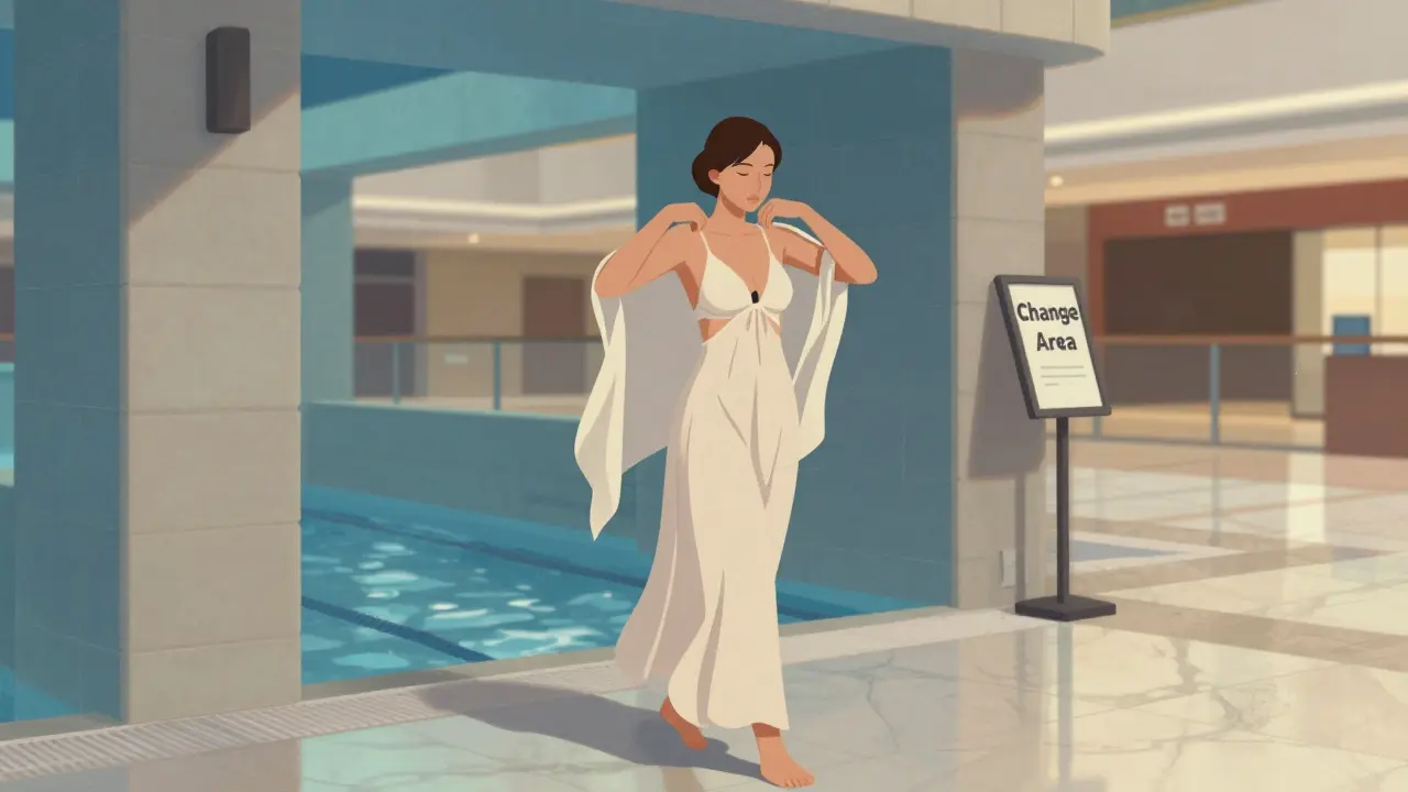 A woman transitions from the water park into the main mall, covering up with a flowing dress and shawl.